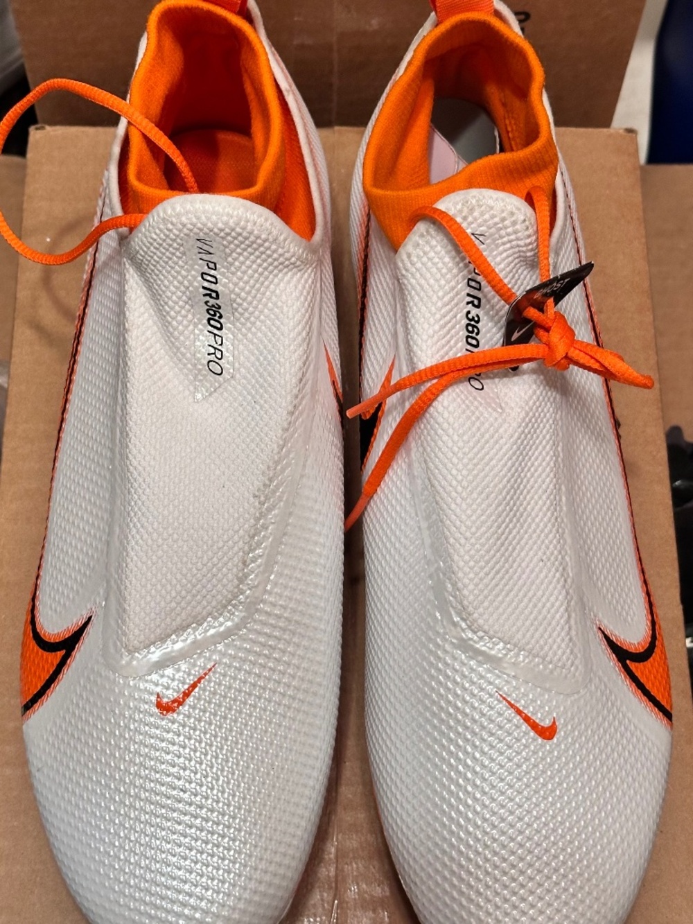 Nike Vapor Edge Pro 360 football cleats featuring a white mesh upper and bright